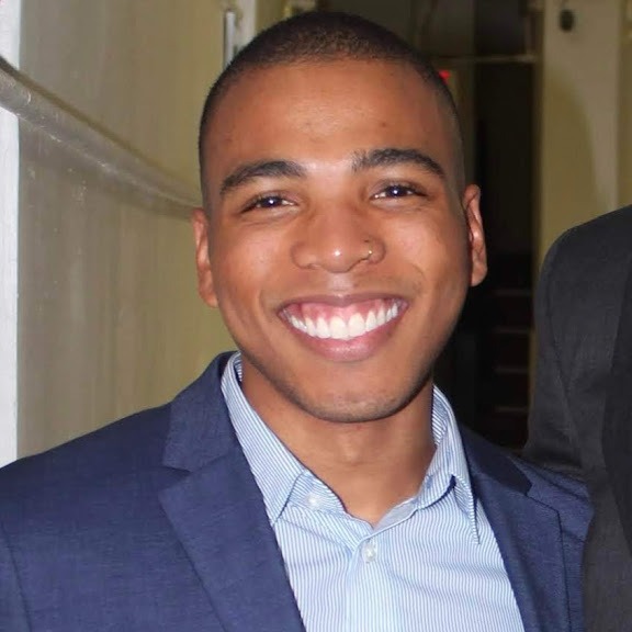 Bryon Lewis-Cummings smiling.